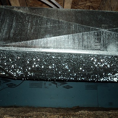 image of ductwork sweating from crawl space humidity