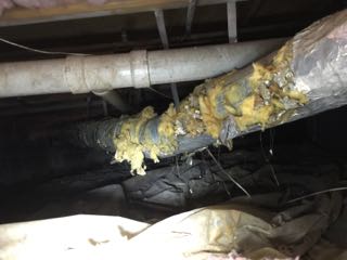 Picture of poorly sealed and insulated ductwork
