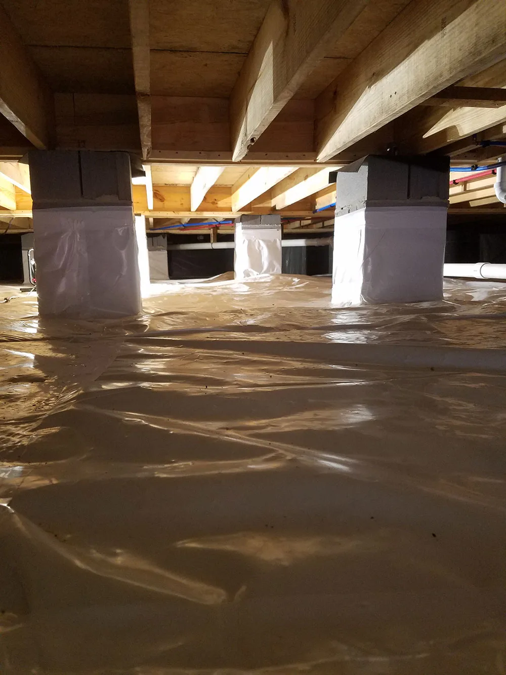 Short Crawl Space Encapsulated Showing Wrapped Pillars After Soda Blasting Mold